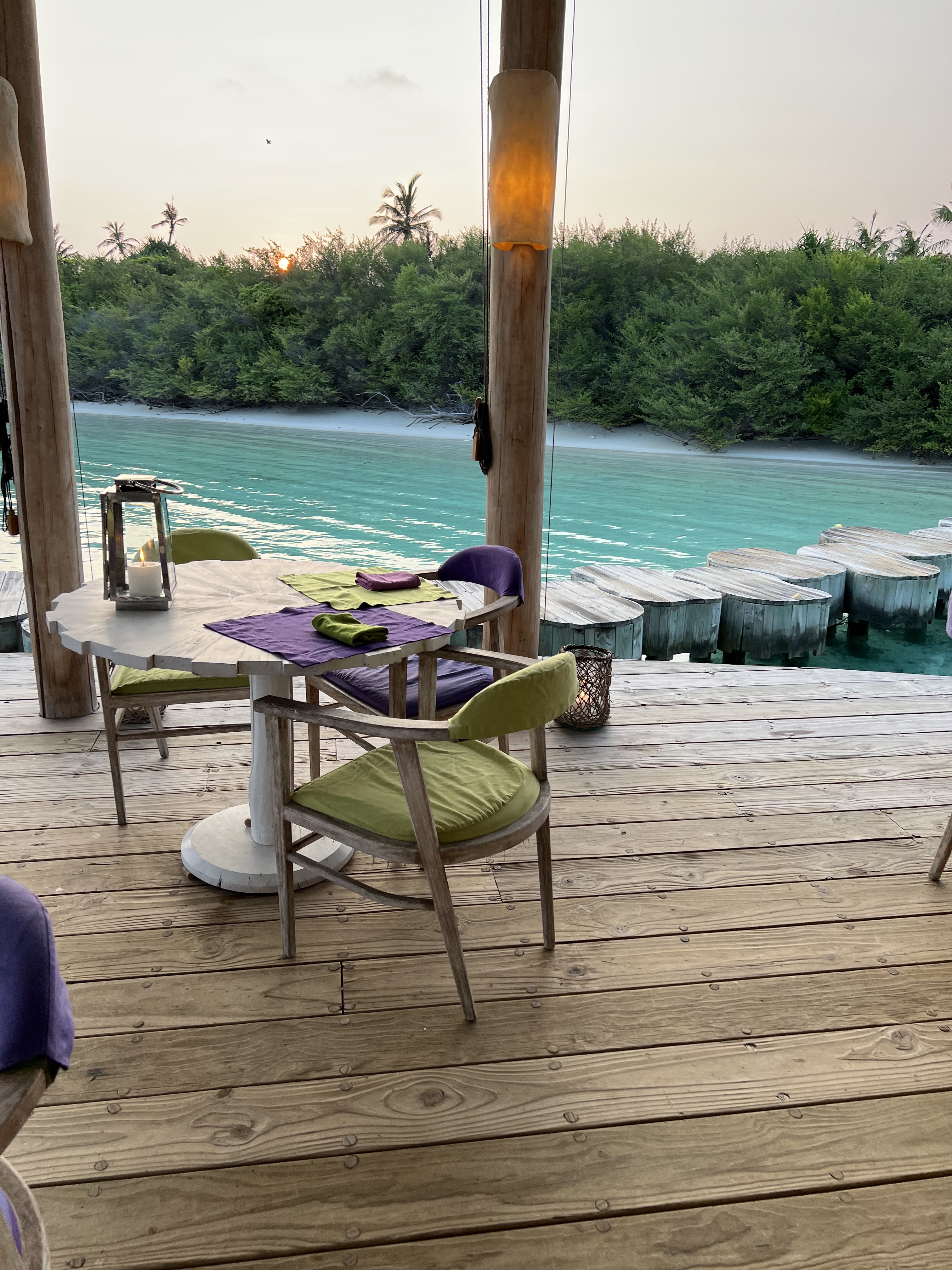 Soneva Jani's spectacular Director's Cut where you can enjoy a set meal while you watch a film at the overwater silent cinema